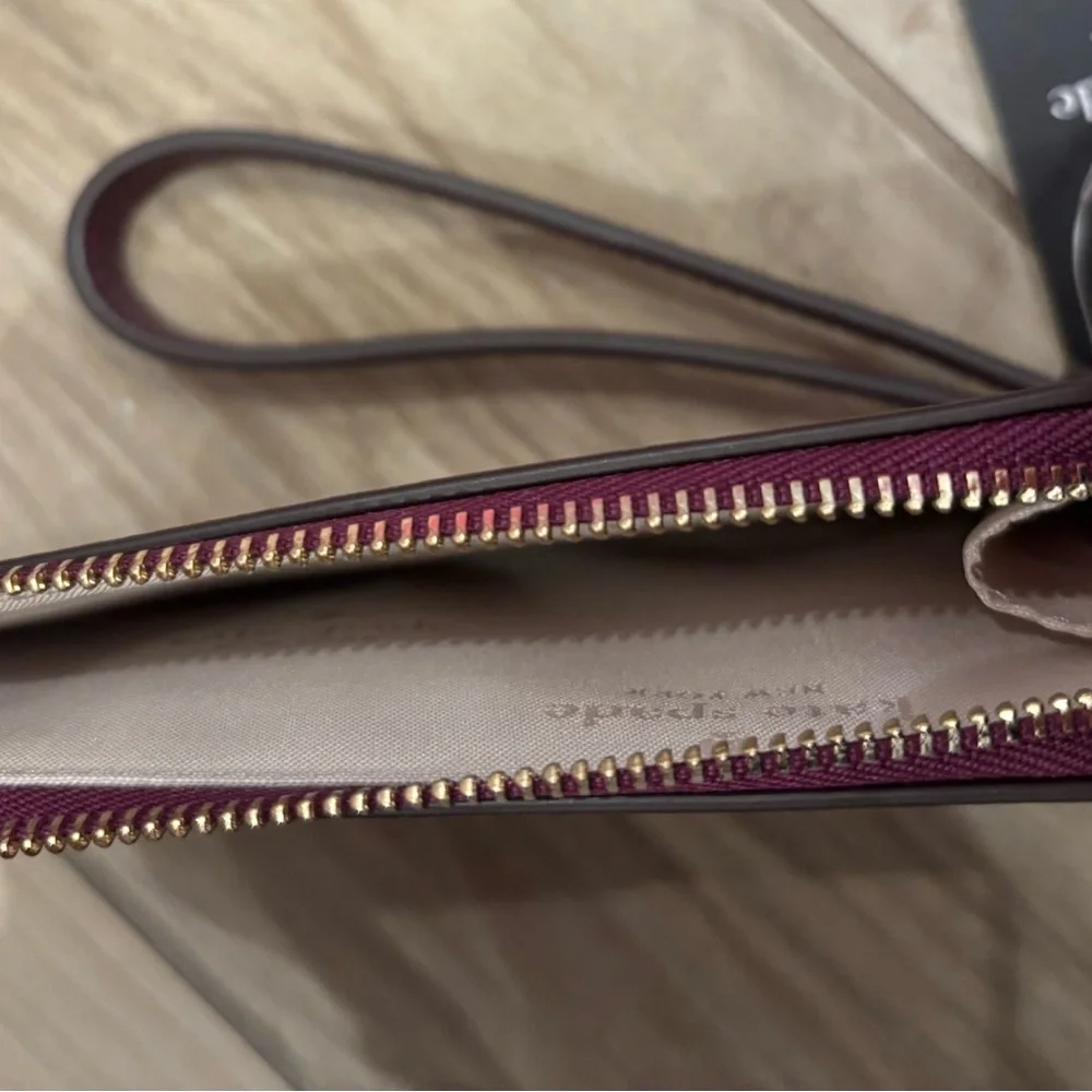 NWT Kate Spade Lucy Metallic Small L-Zip Wristlet in dark raspberry
